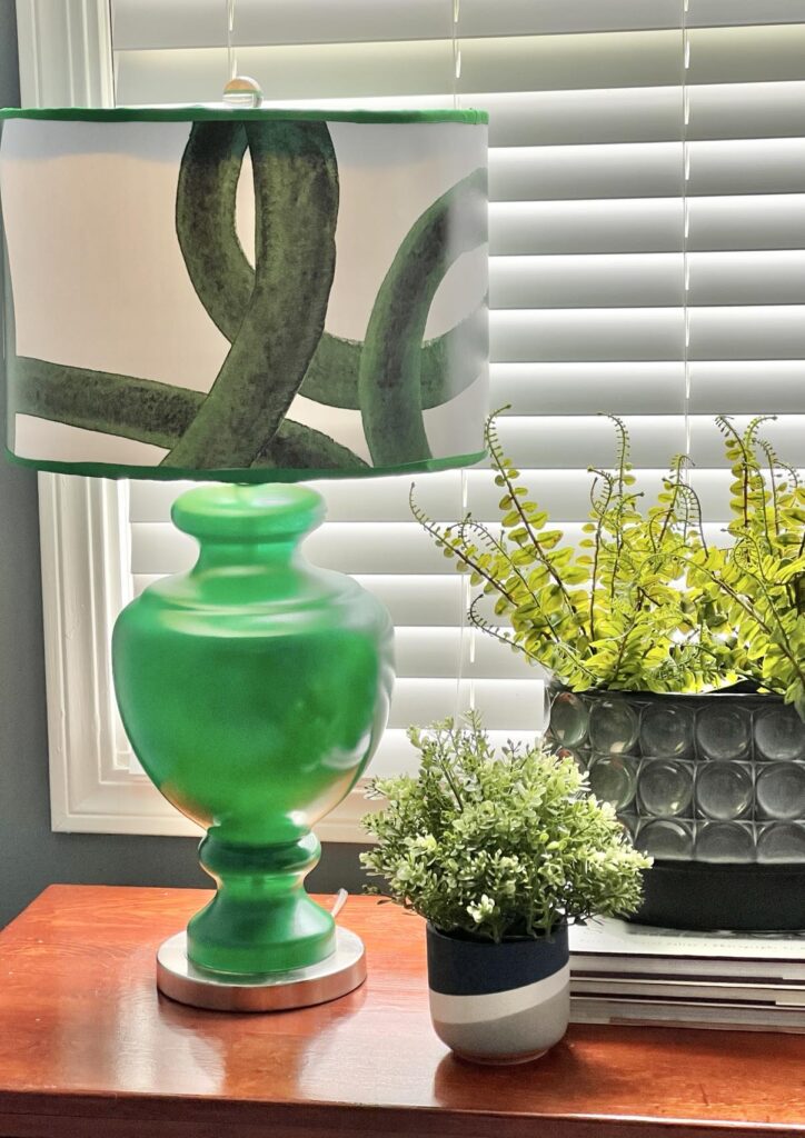 Faux plants in pots on a dresser.