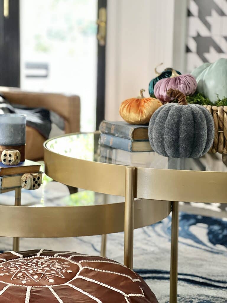 Velvet pumpkins on a coffee table.