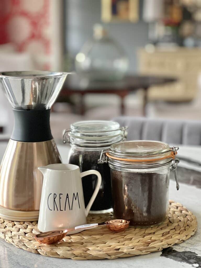 https://www.sonatahomedesign.com/wp-content/uploads/2023/04/Ground-coffee-stored-in-glass-jars-in-the-kitchen-Sonata-Home-Design-768x1024.jpg