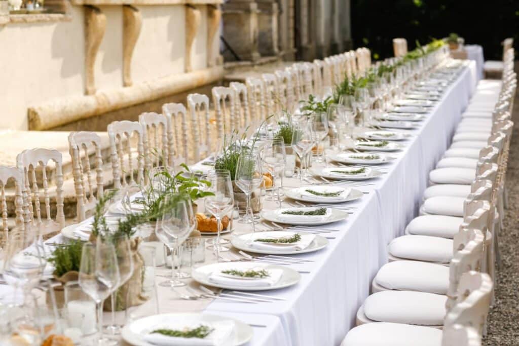 a cream tonal table runner on a long banquet table.