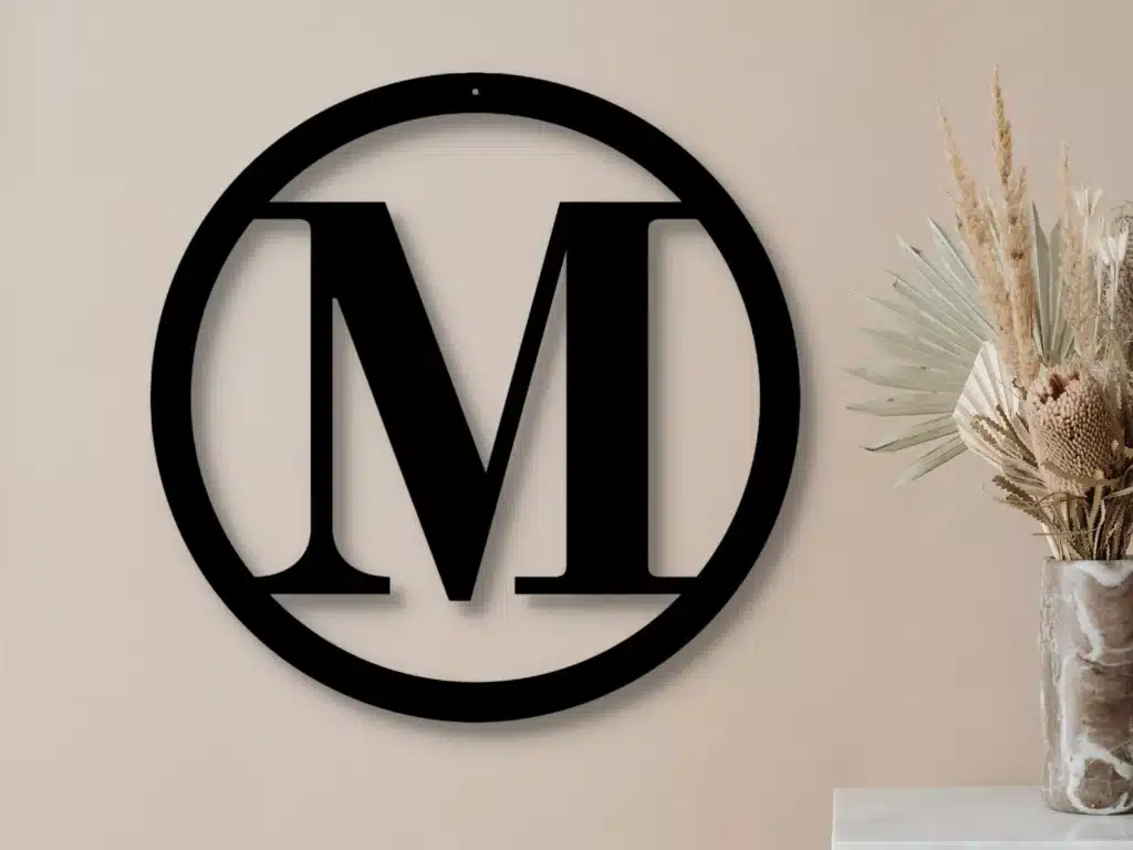 An outdoor metal initial "M" for the front door.