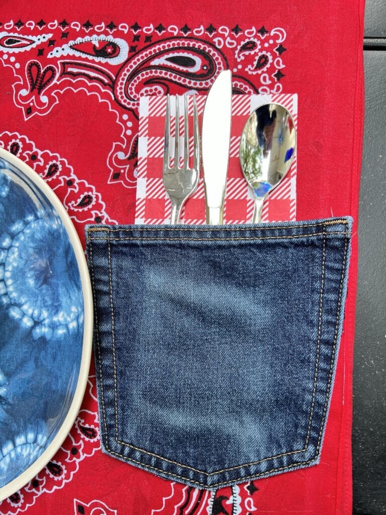 How to make a placemat: A knife, fork, and spoon nestled into the denim pocket on the placemat.