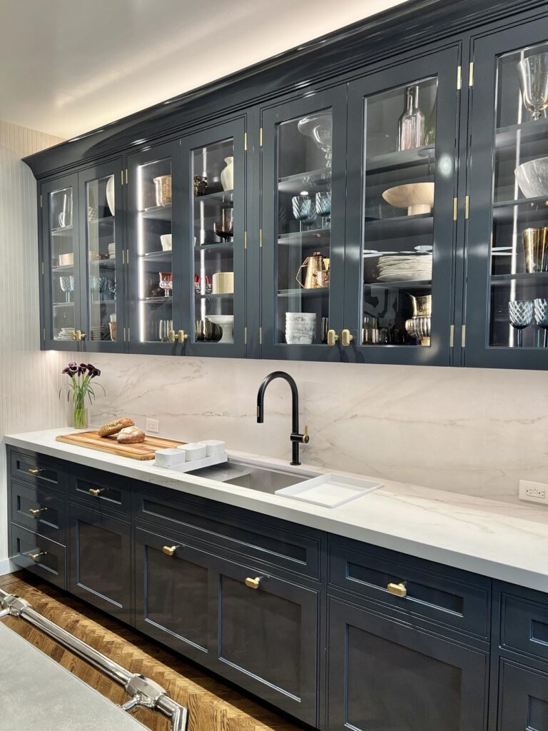 Black cabinets in the Kips Bay Decorator Show House kitchen in New York City.