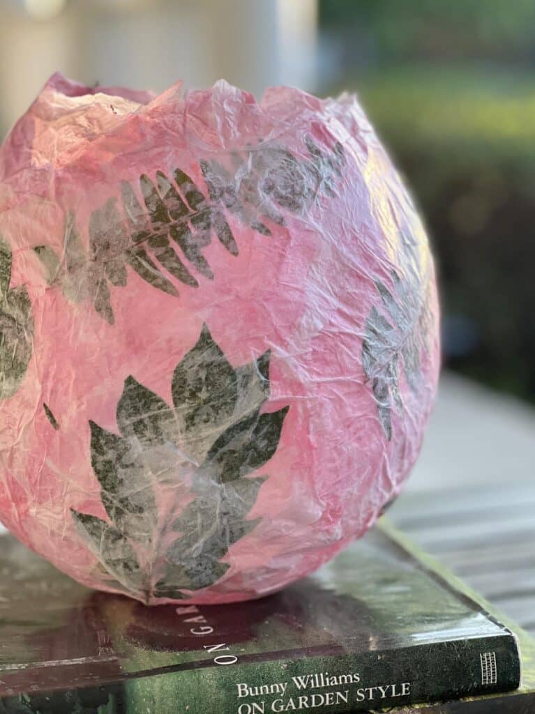A pink and green Diy Tissue Paper Lantern.