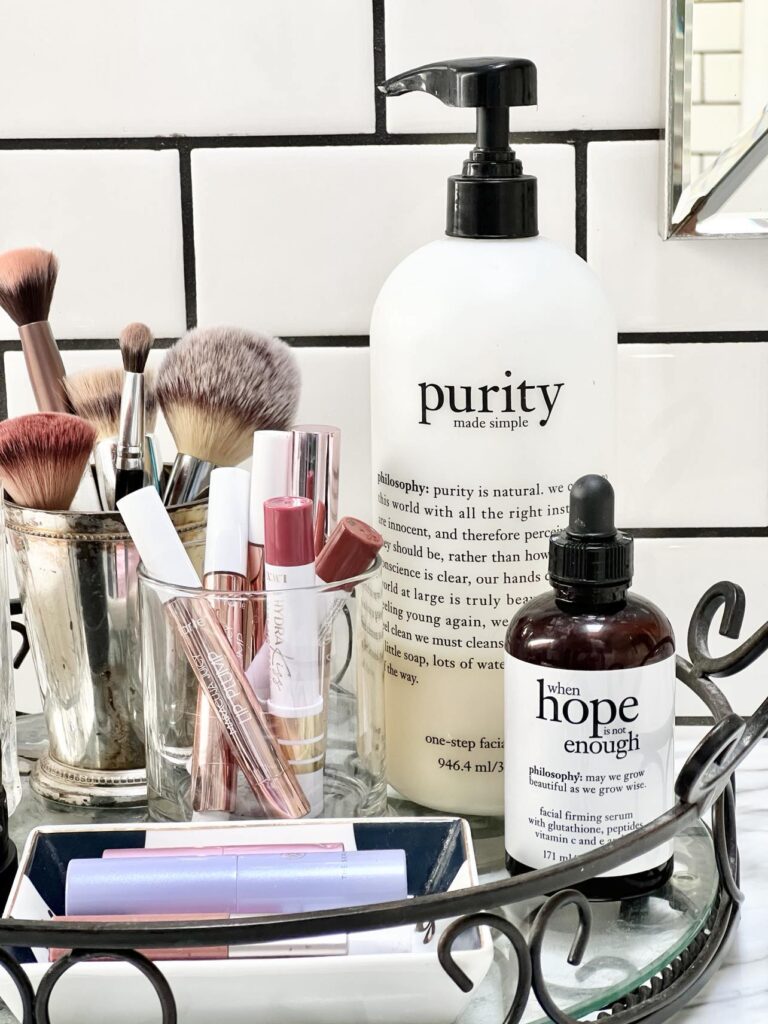 A vanity tray full of products that help with good skin habits and care.