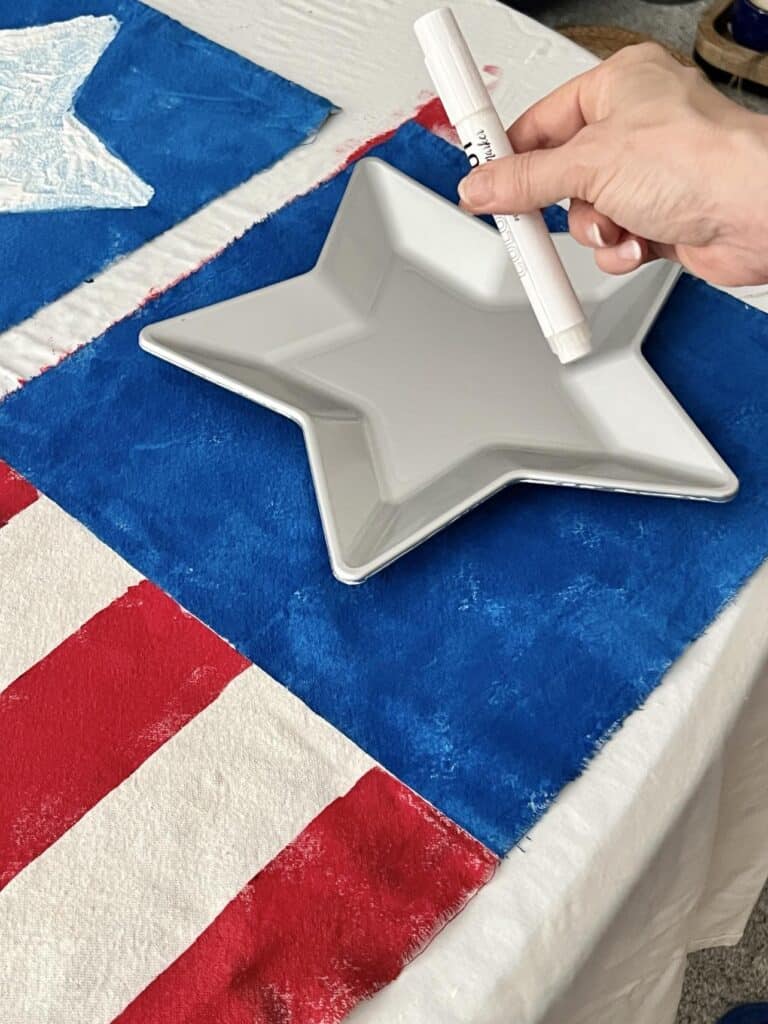 A star shaped plate and white paint pen.