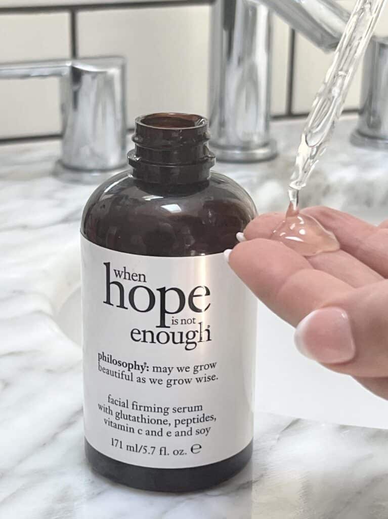 A bottle and dropper with face serum used in daily skin habits.