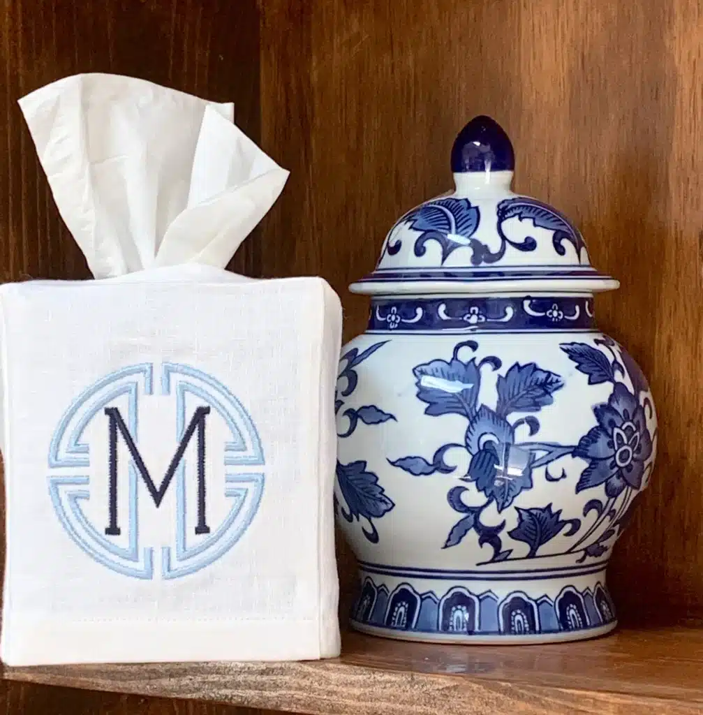 A home finds monogrammed linen tissue box covered with the letter "M"