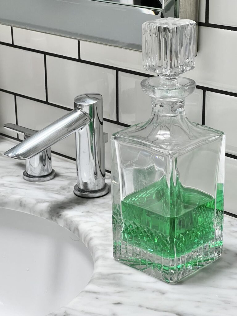 A cut-glass decanter filled with mouthwash is an unexpected little luxury.