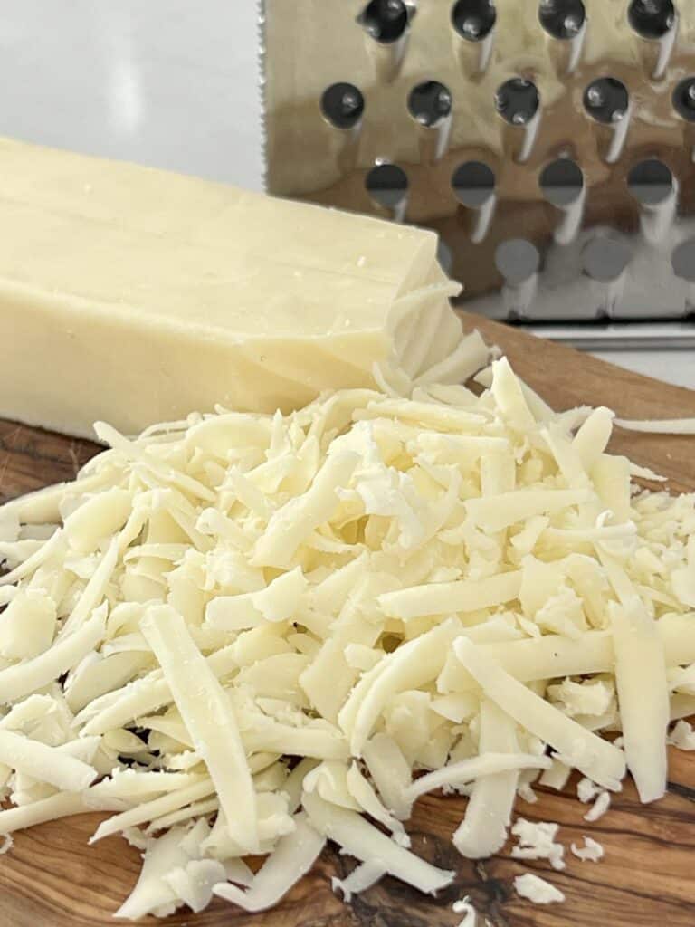 A pile of shredded mozzarella cheese.