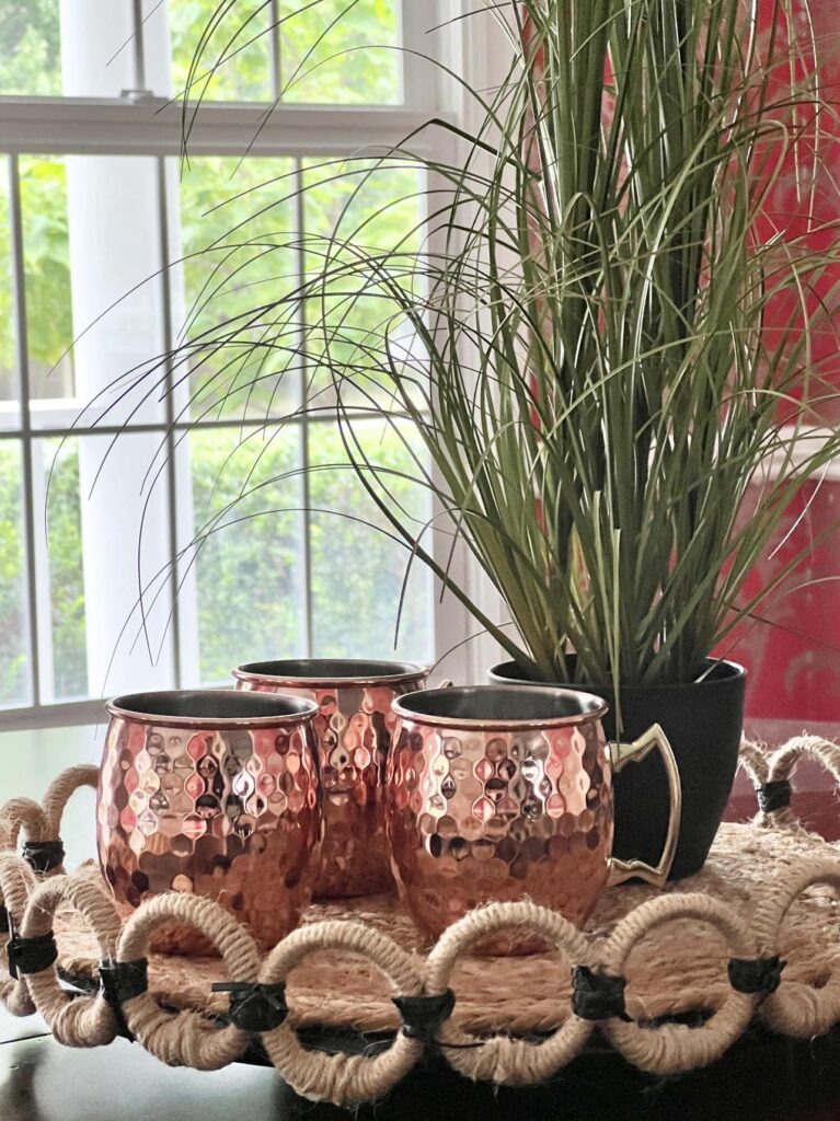 Moscow mule cups sitting on a DIY lazy Susan.