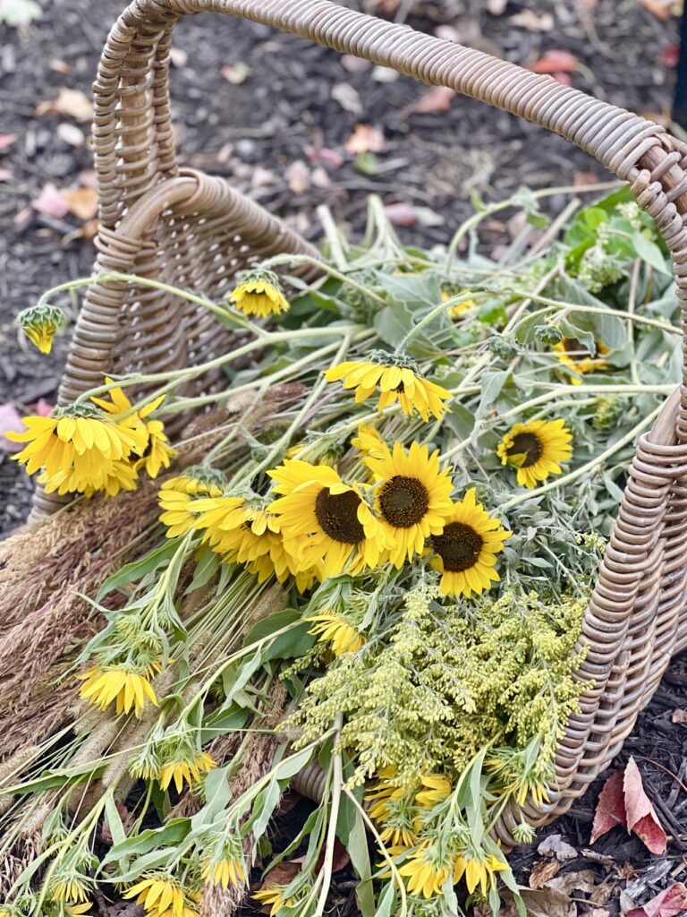 A basket of foraged flowers to decorate tree branch decor ideas.