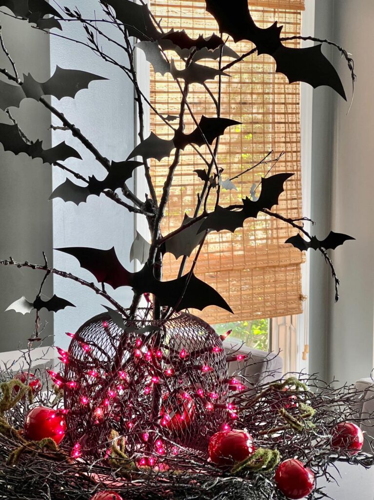 A diy bat branches centerpiece in the kitchen.