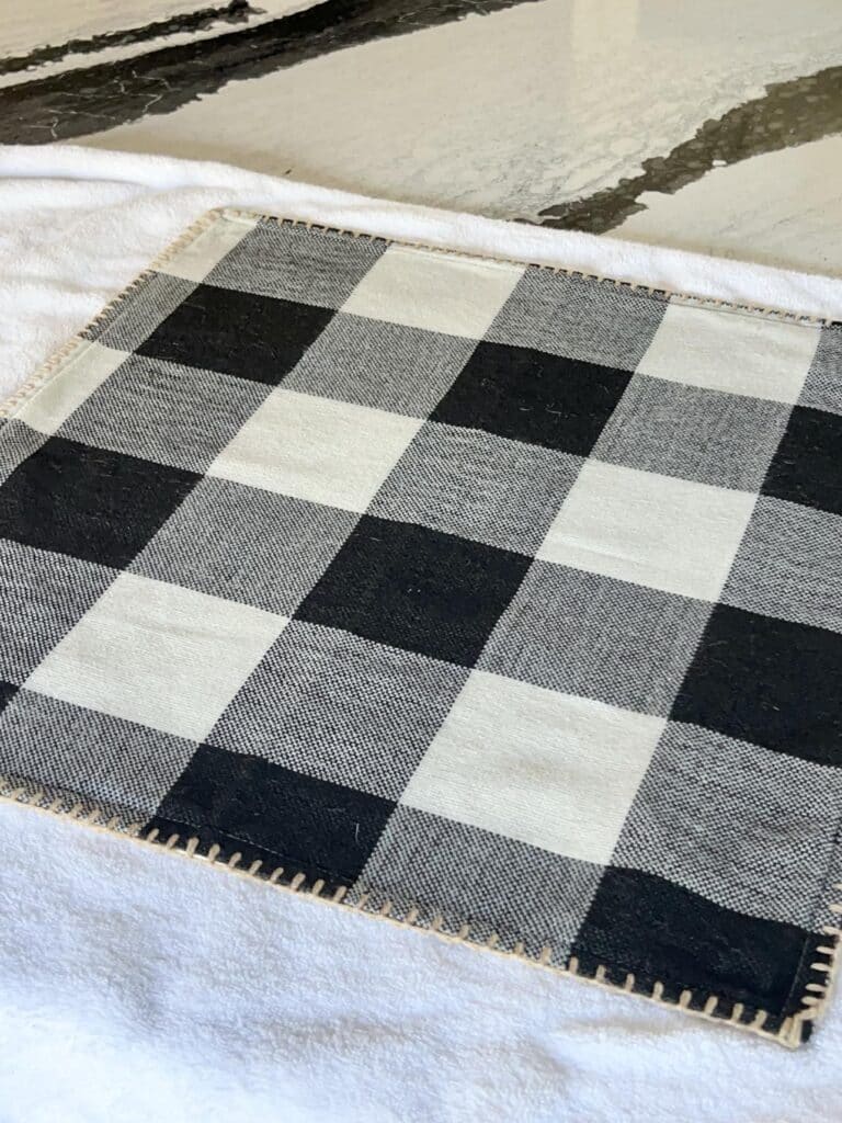 Drying a pillow cover after hand washing.