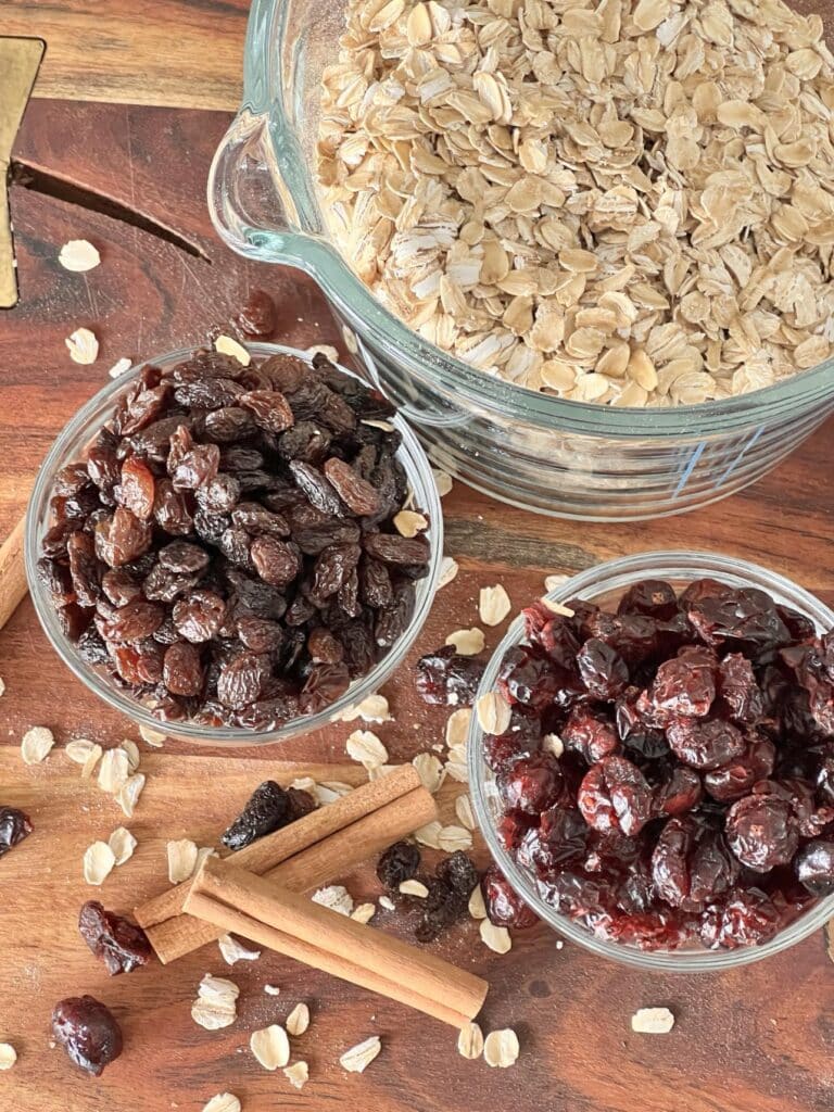 Oats, raisin, and cranberries for bakery style chewy oatmeal raisin cookies recipe.