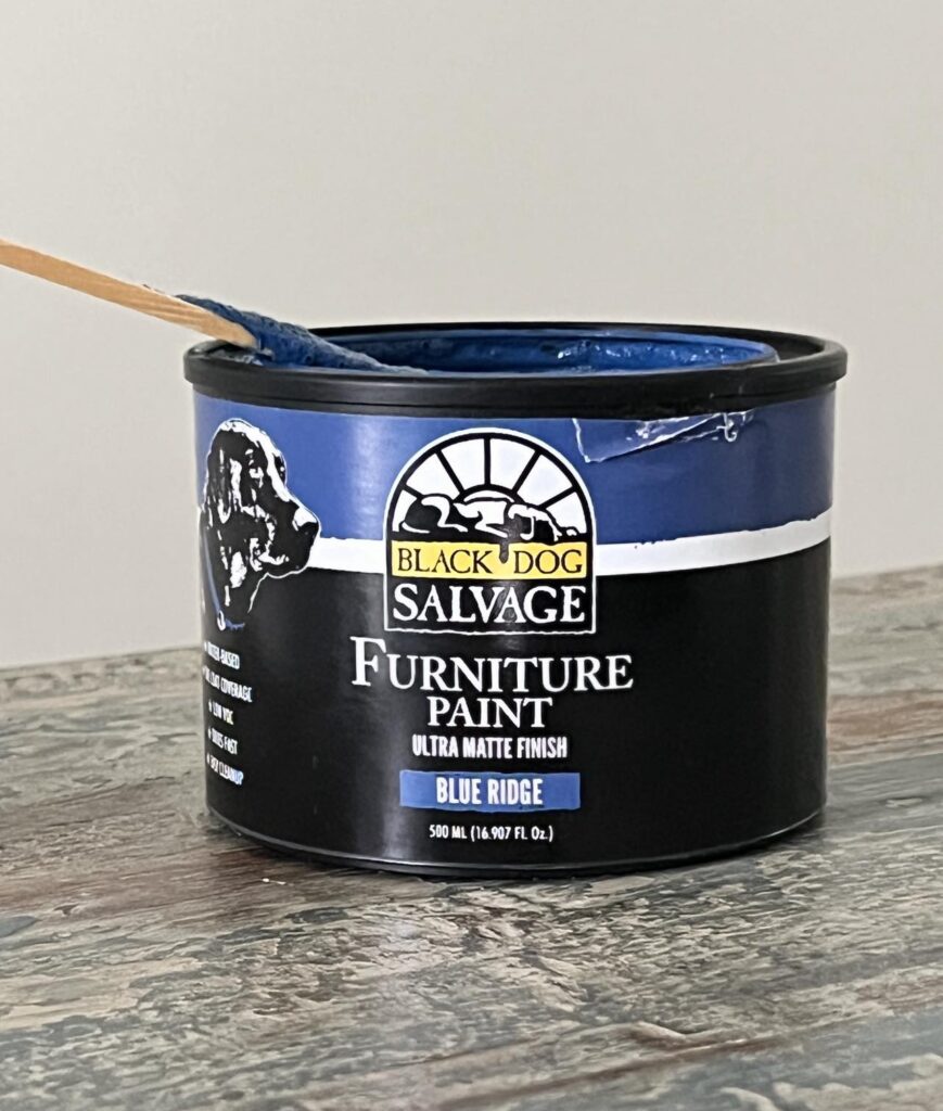 A can of Black Dog Salvage paint in the color "Blue Ridge"