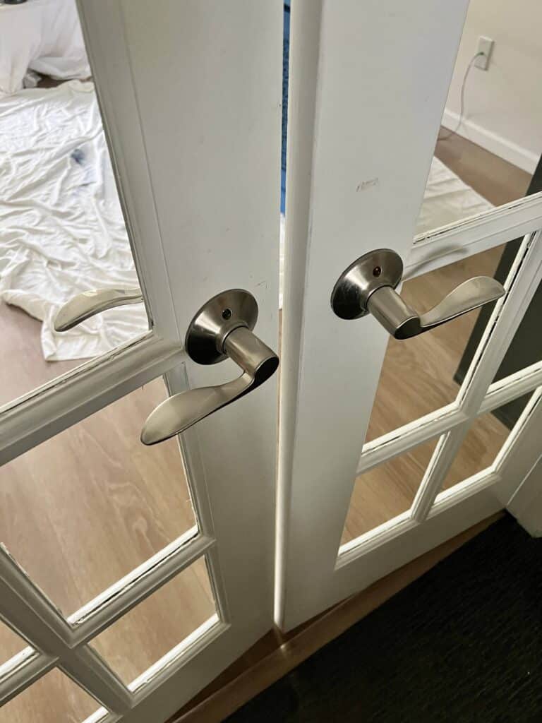 Knowing how to paint French doors with door handles.