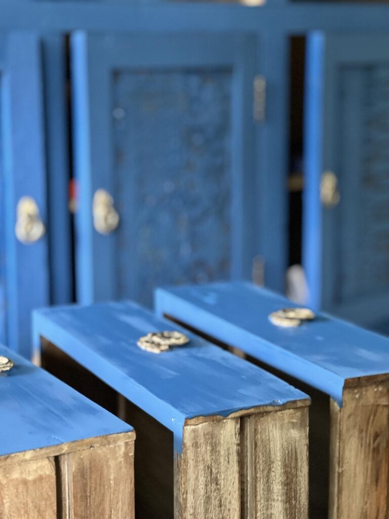 Painted credenza drawers drying.