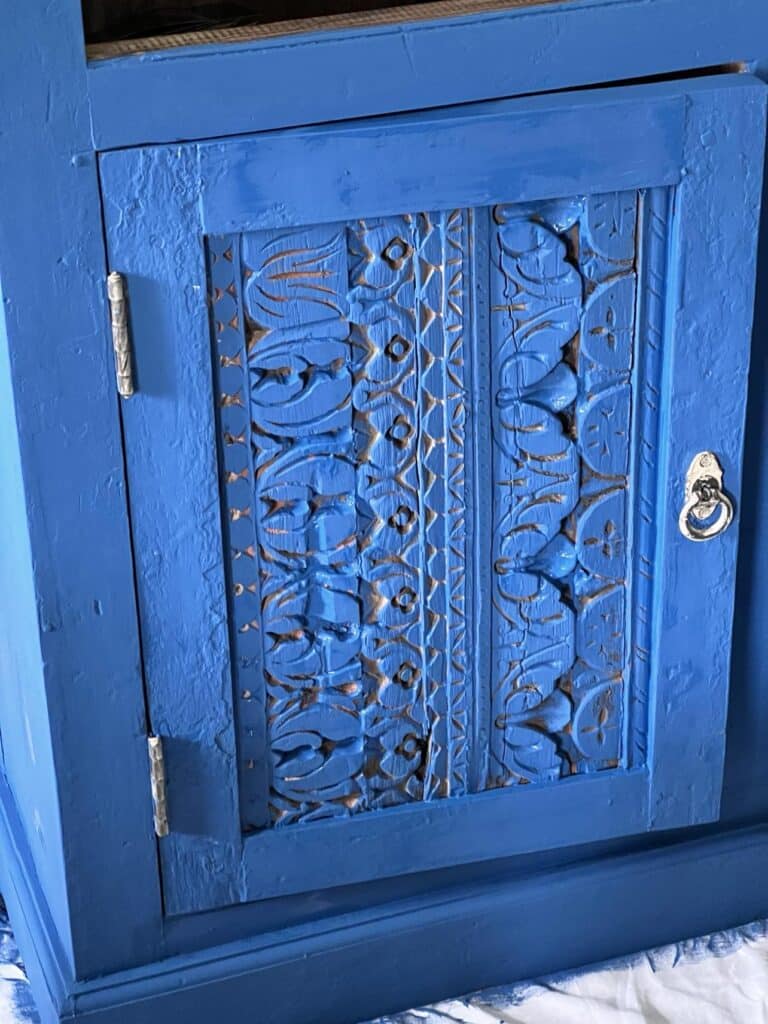 A painted furniture credenza door.