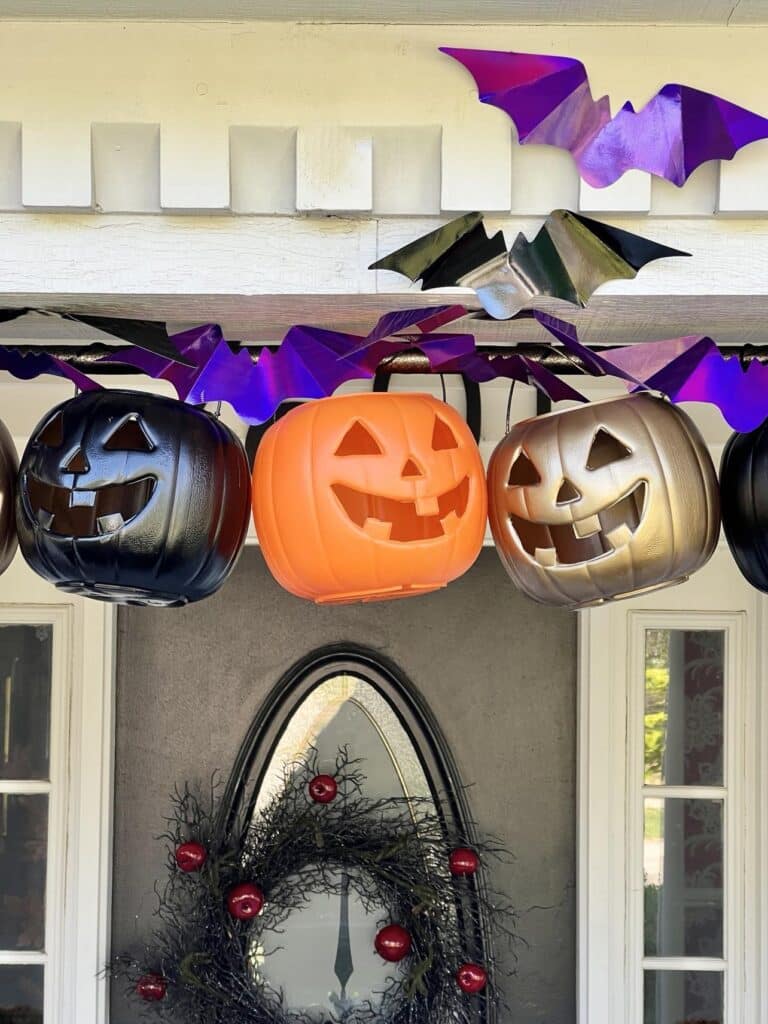 Tension rod pumpkin porch decor for Halloween.