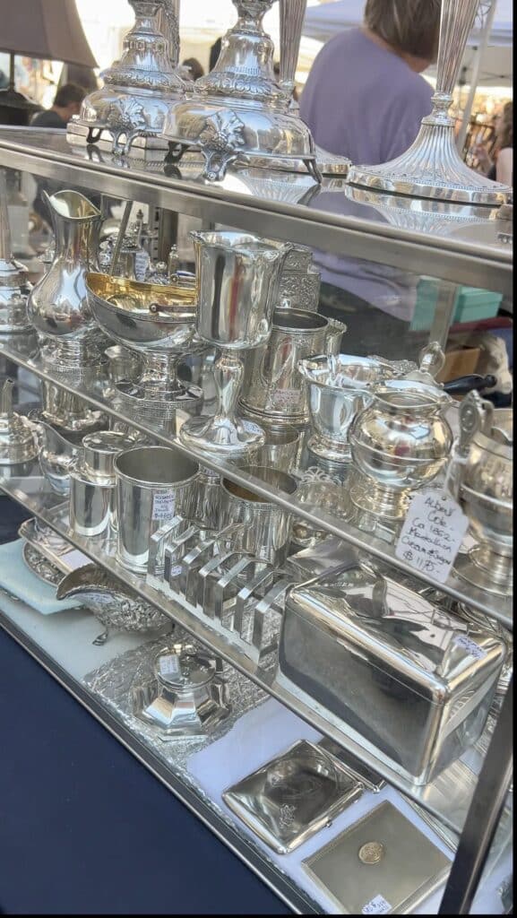 Shelves of antique silver.