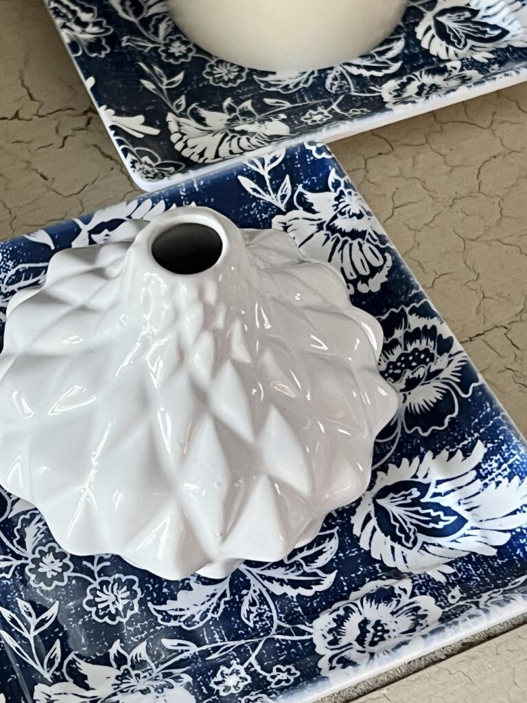 White vase on blue and white tray found at chelsea flea market manhattan.