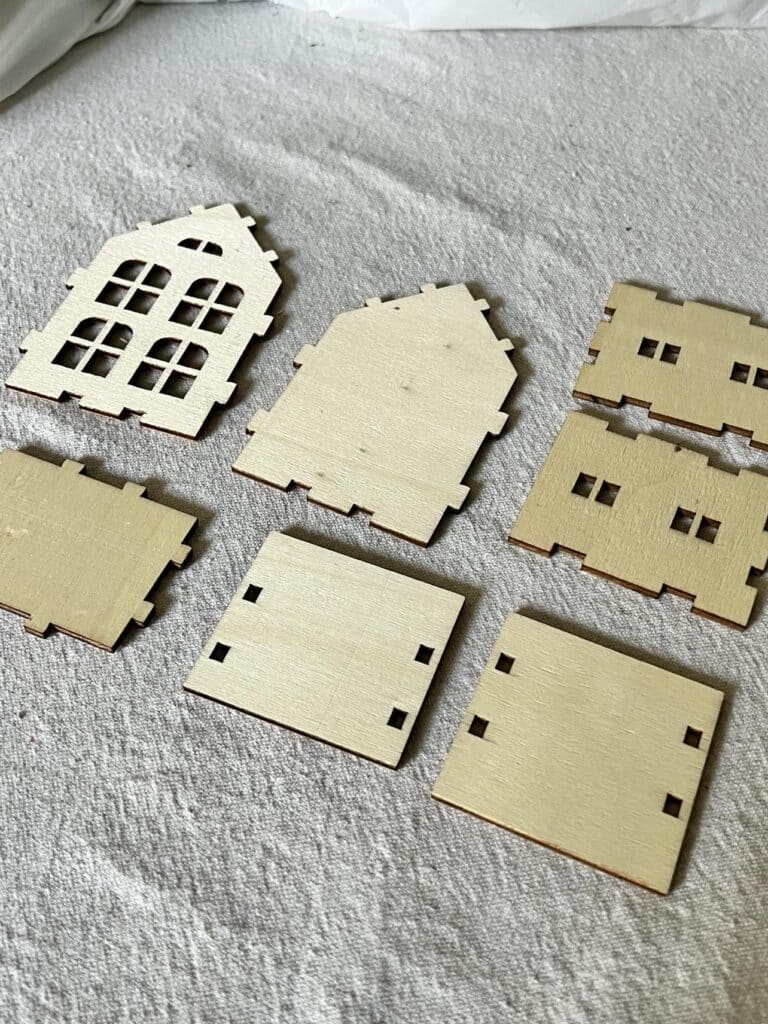 House puzzle pieces laid out on table.