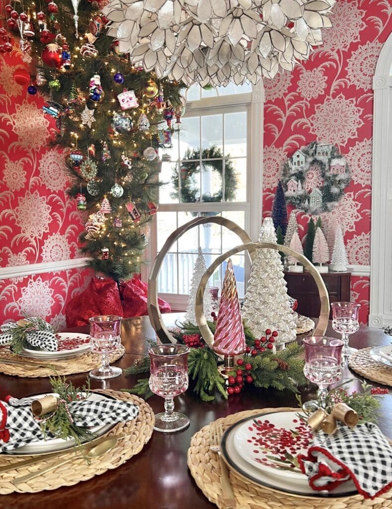 A dining room table set with Christmas decor for a holiday home tour.