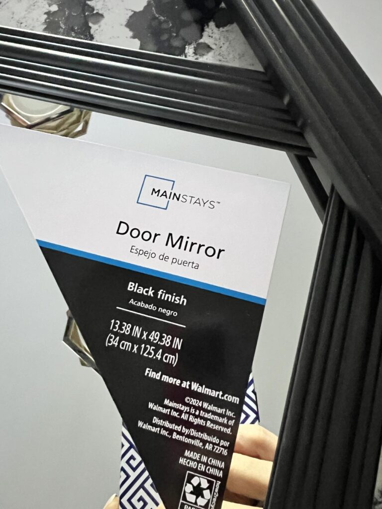 stock rectangular dorm mirror with black frame for the base of the mirror hack.