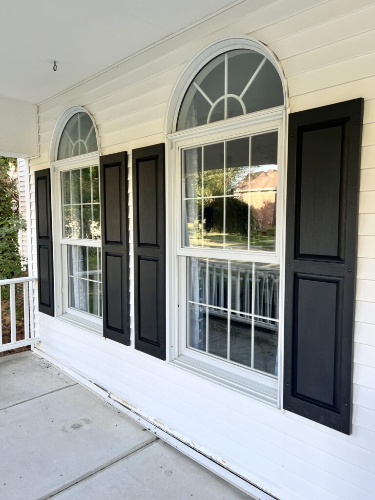 front porch ideas include new vinyl flat panel shutters on the windows.