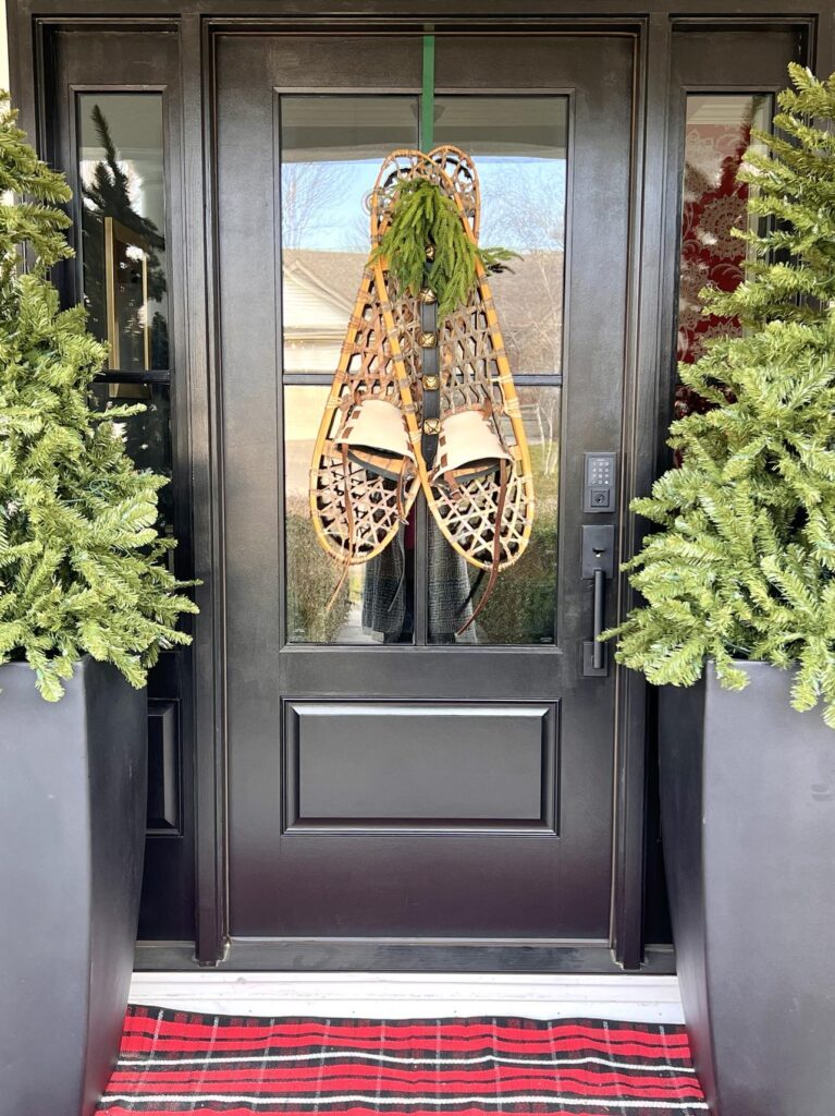 Snowshoes decorating a front door.