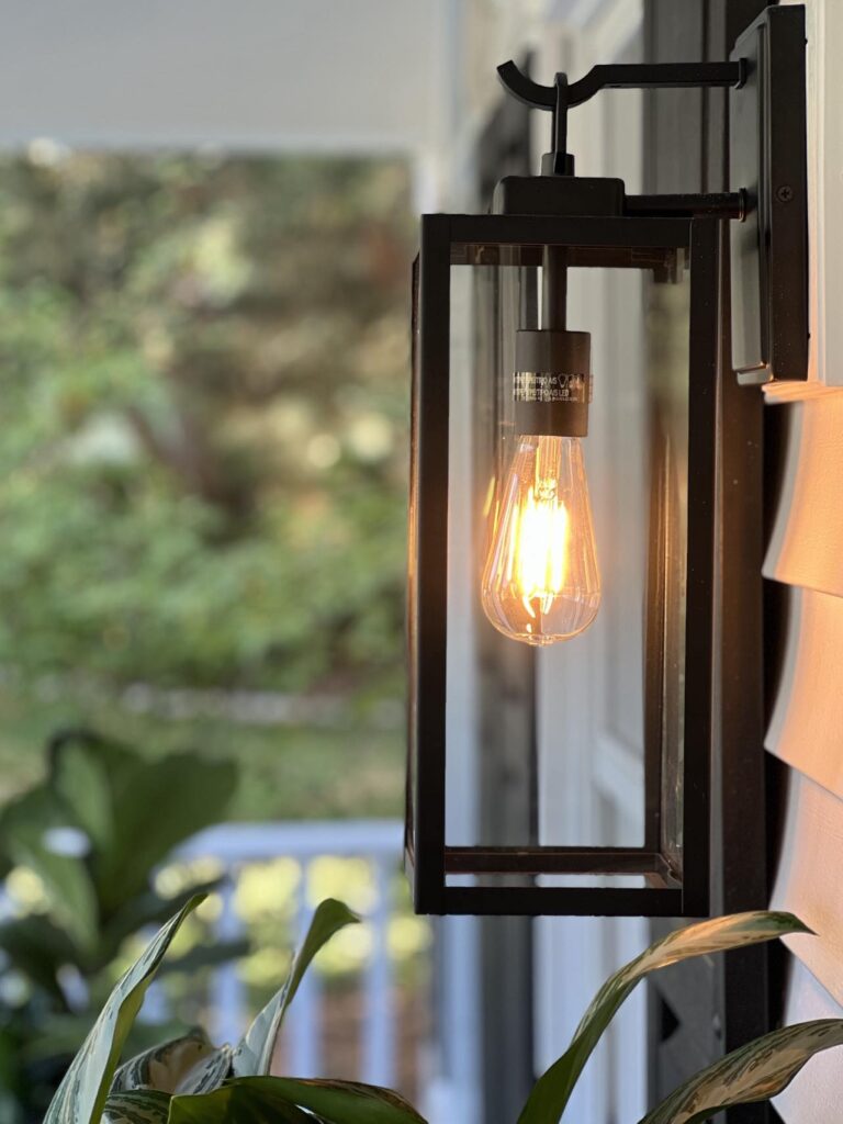 Outdoor wall sconce lighting is one of many front porch ideas.