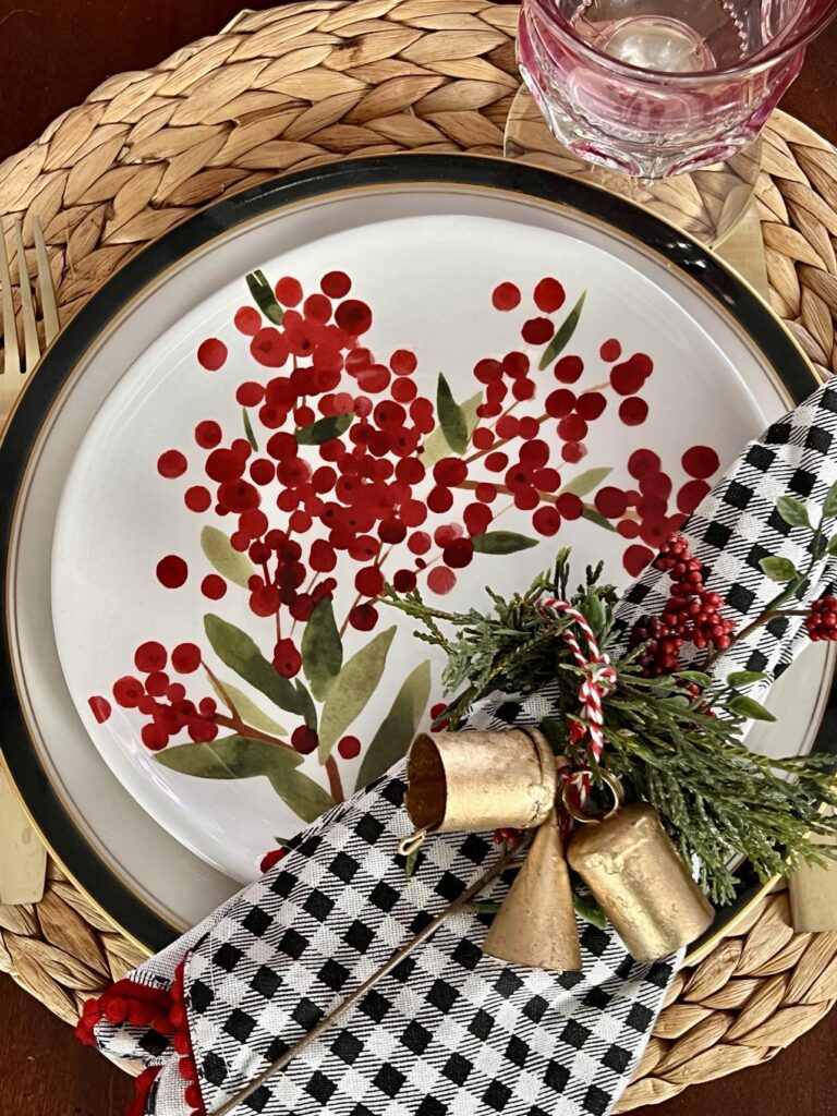 A Christmas plate with red berry design.