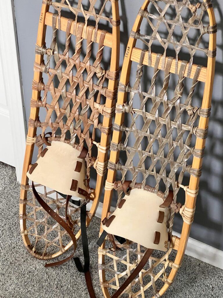 Snowshoes propped against a wall.