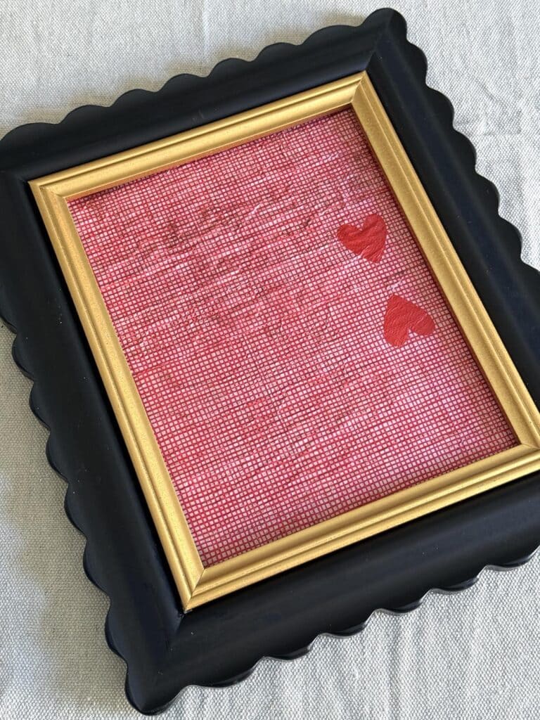 a photo frame with decoupage background for Valentine art.