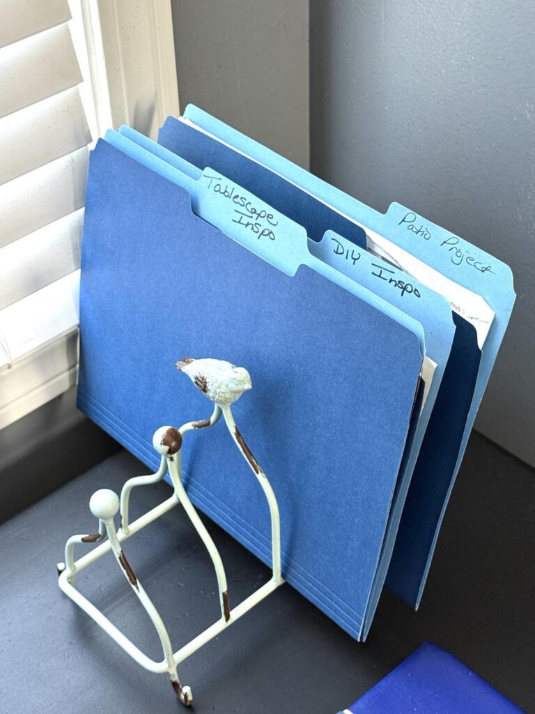 File folders in a desk file holder decorated for a bedroom.