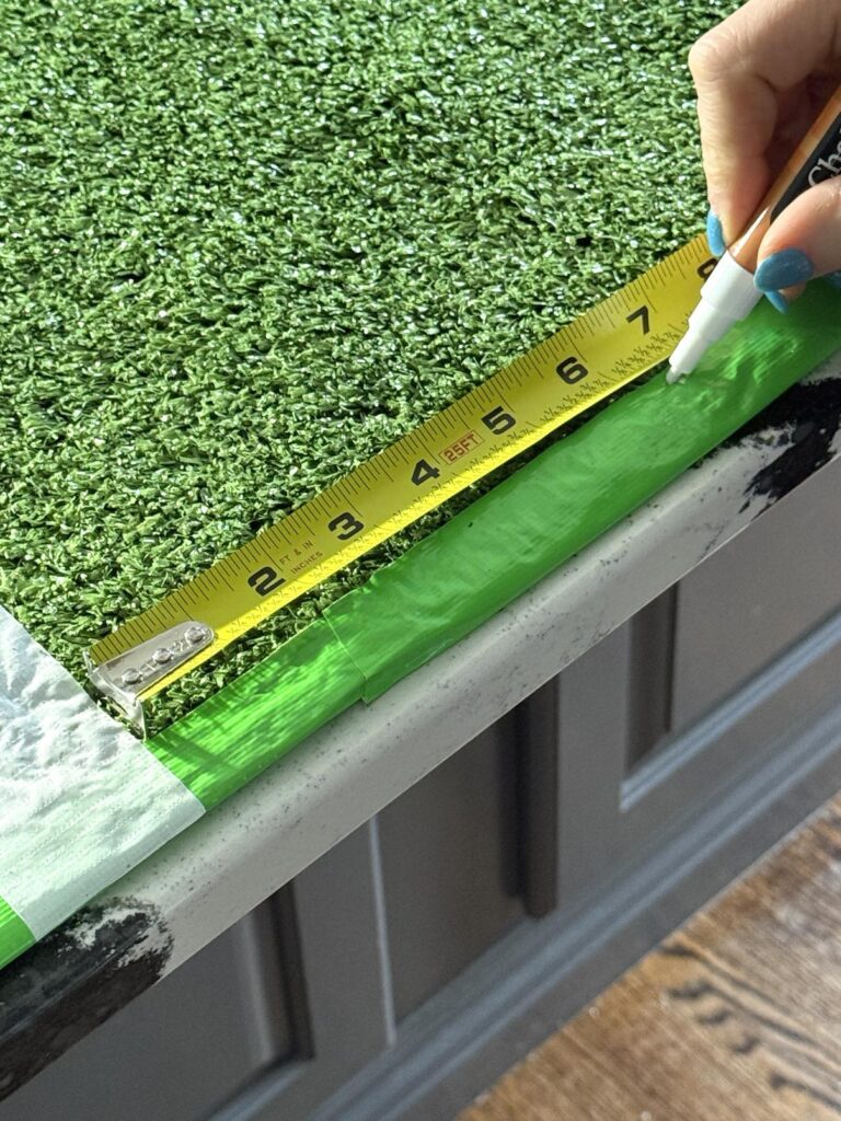 Measuring for yard lines on DIY Super Bowl table.