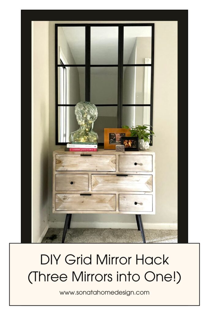 DIY grid mirror hack hanging above a console table in a hallway.