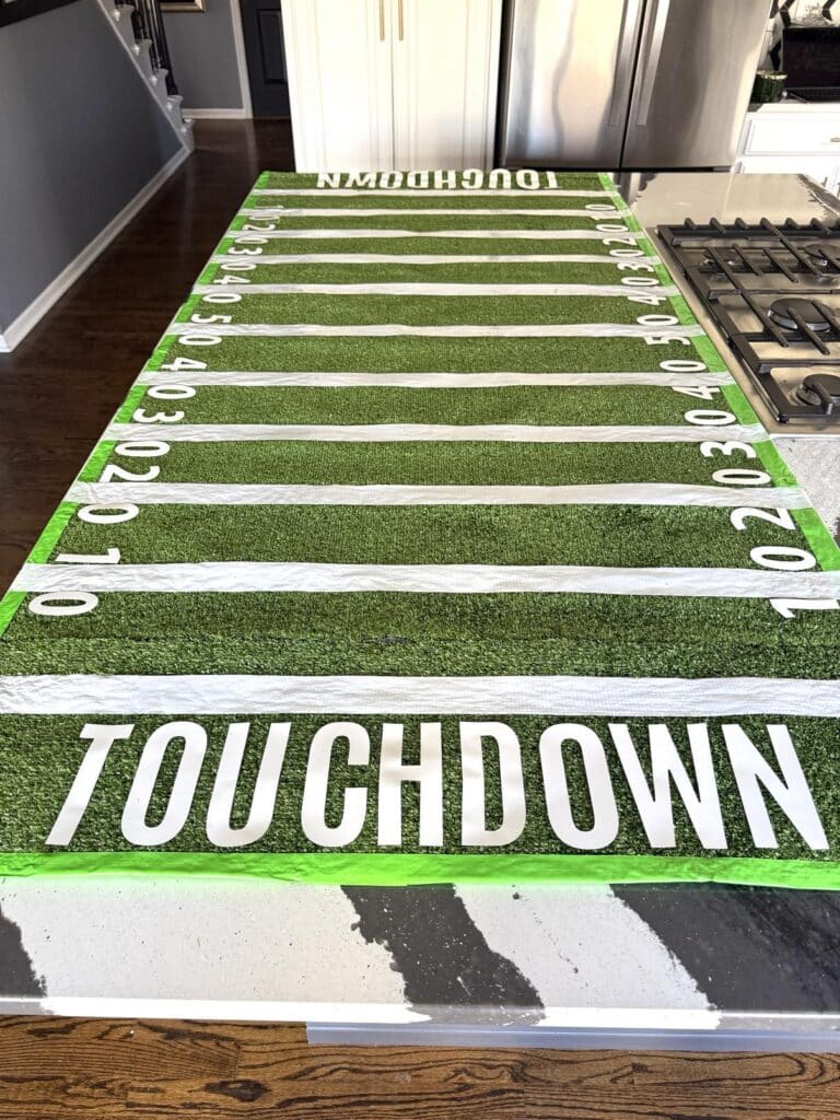 A DIY artificial grass football field Super Bowl table for entertaining.