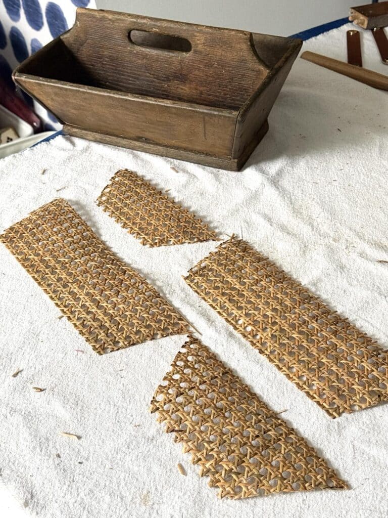 Four cut pieces of rattan for a diy wood box centerpiece.